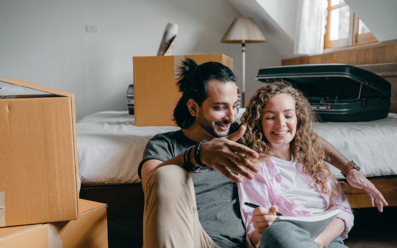 First time buyers discussing mortgage options when purchasing their first home